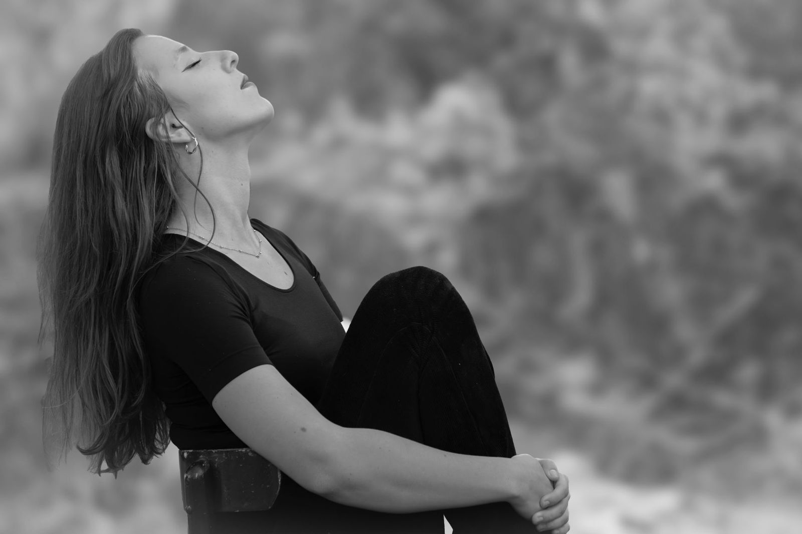 Woman practicing slow deep breathing outdoors