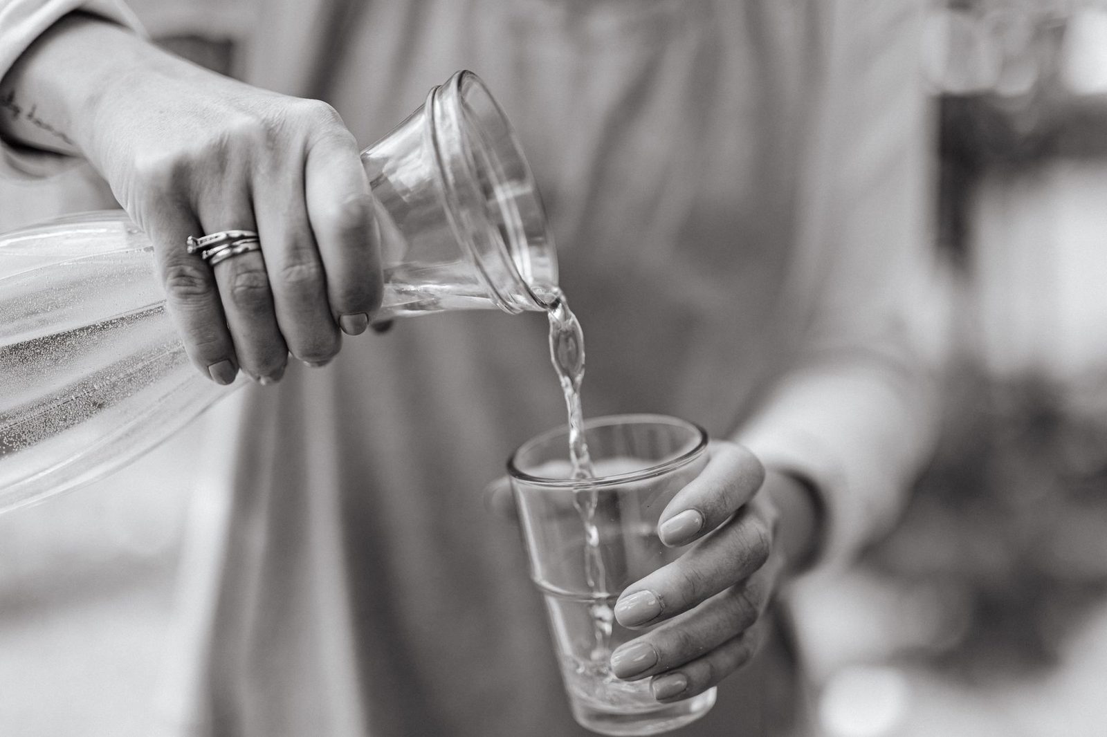 Clear water pouring gently into a glass