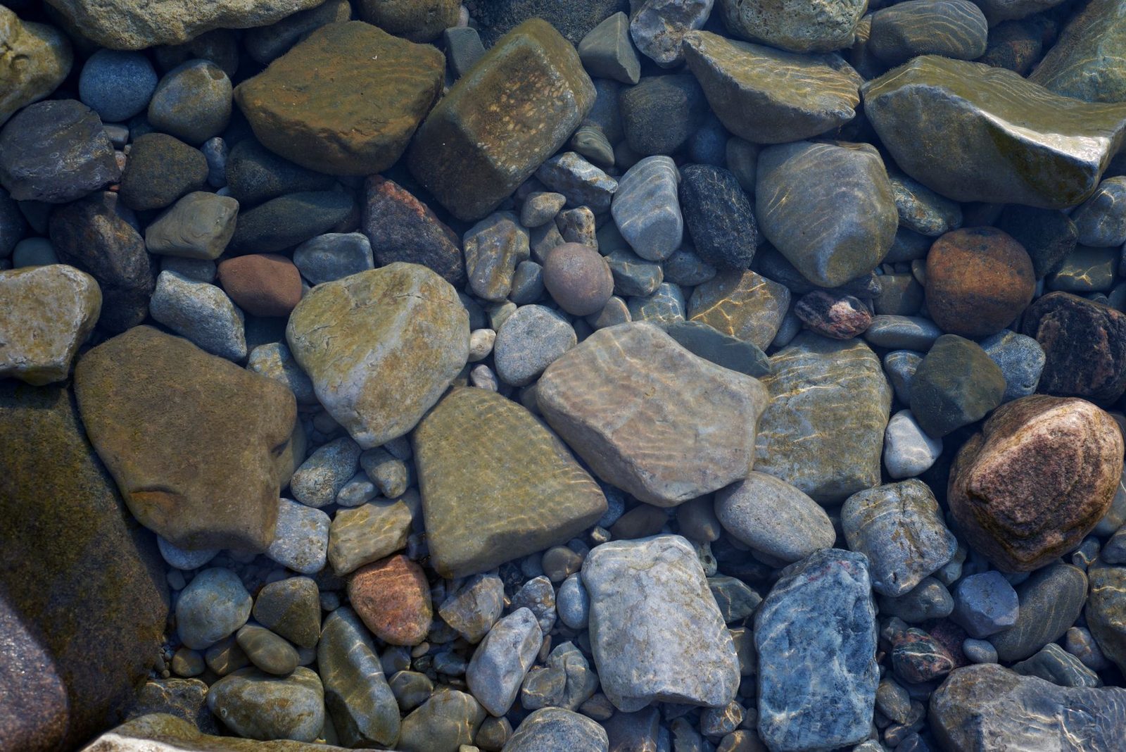 Smooth river stones worn round by water